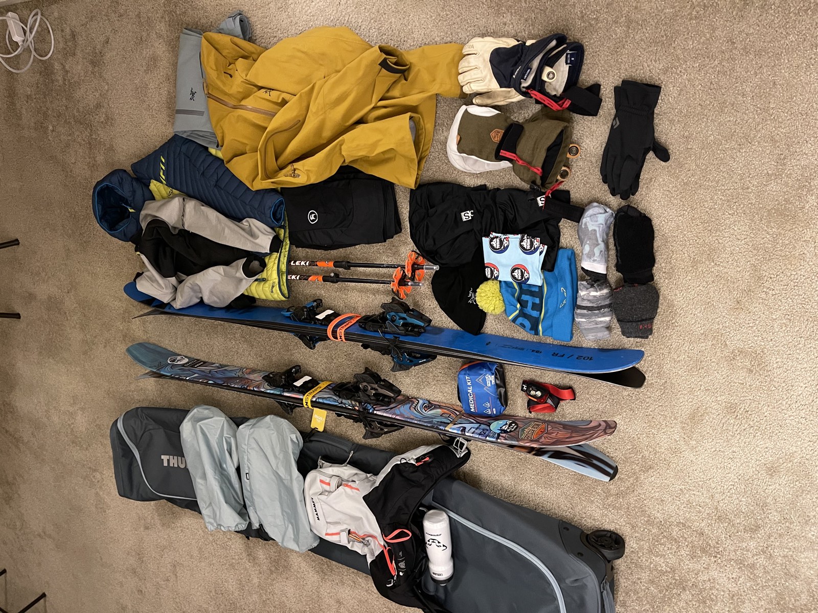 Ski gear laid out and packed for the flight