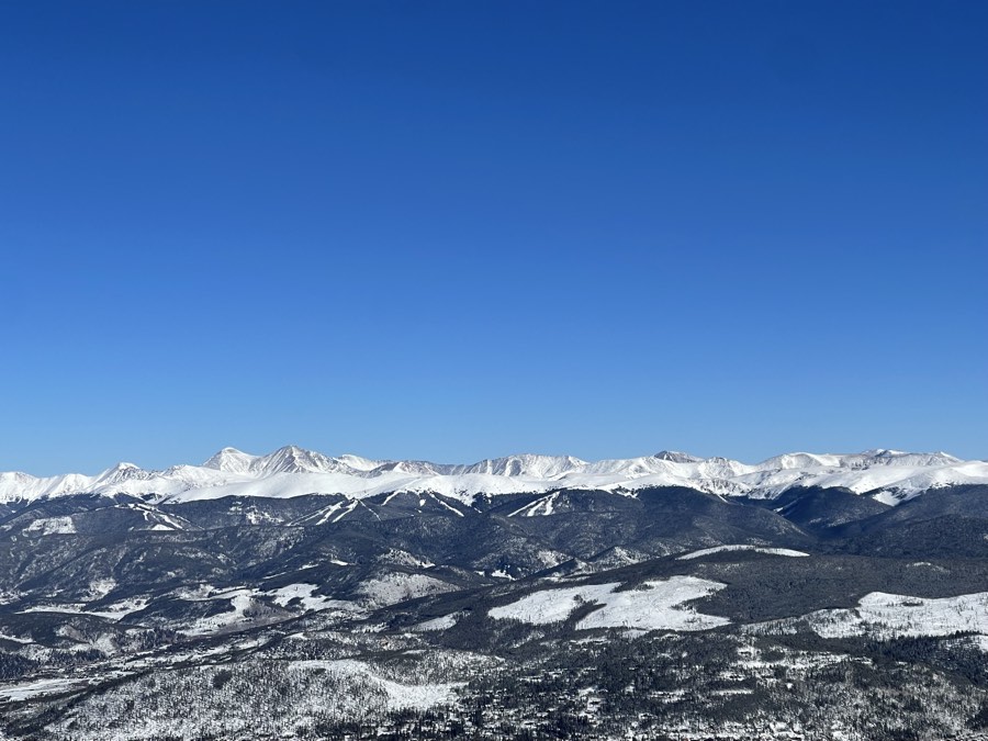 A line of snowy peaks along the Front Range