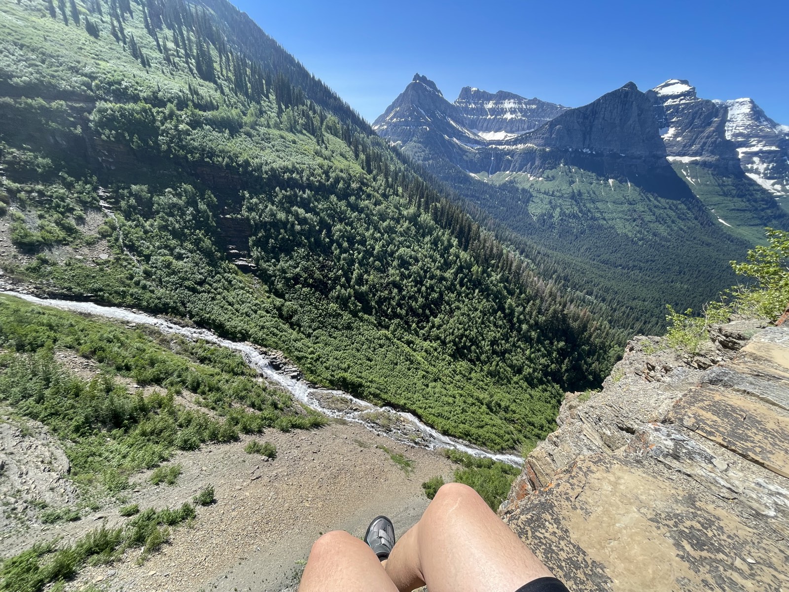 Sitting above a wide drop-off with mountains all around