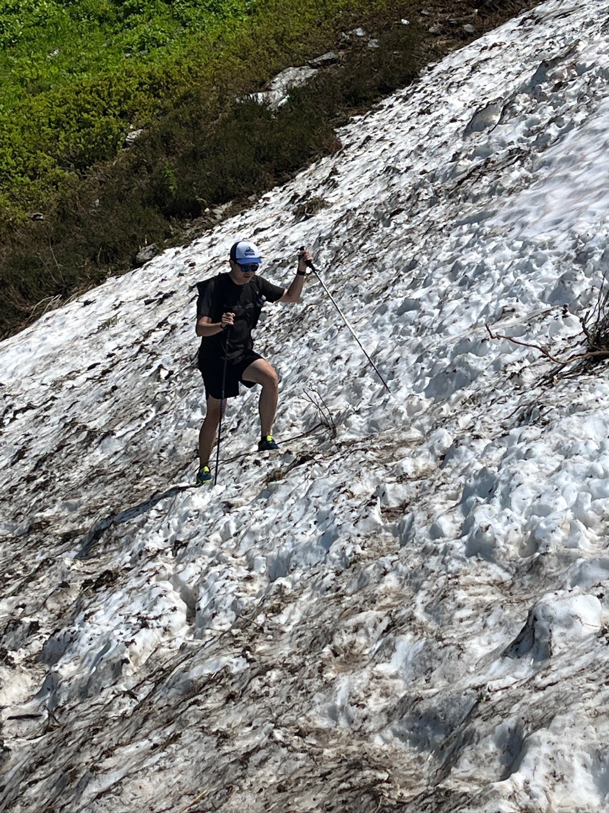 A lingering snowfield lying across the route