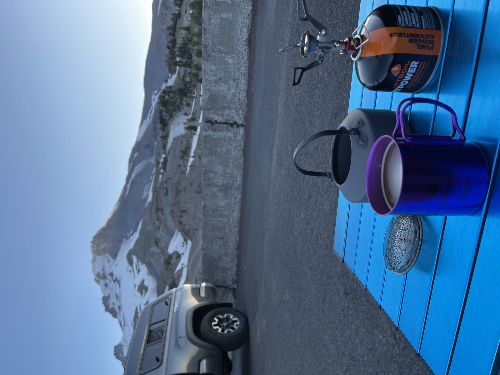 Coffee on the car hood at sunrise in the Timberline parking lot