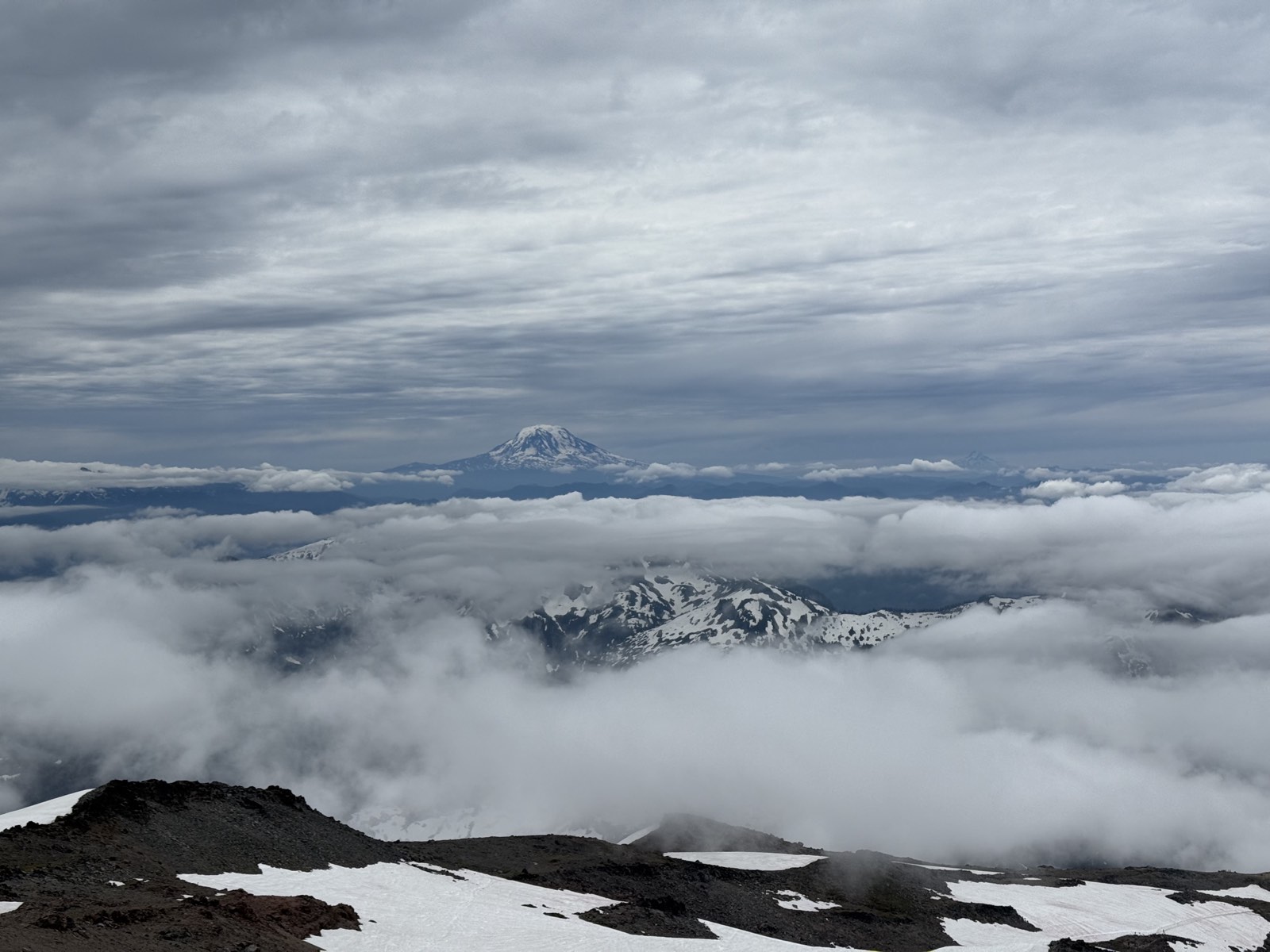 Mount Adams standing far off above the cloud layer