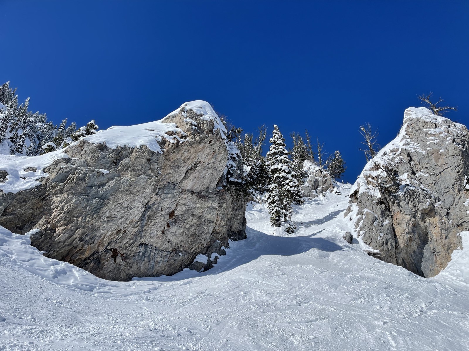 Clear blue sky above a steep chute at Bridger