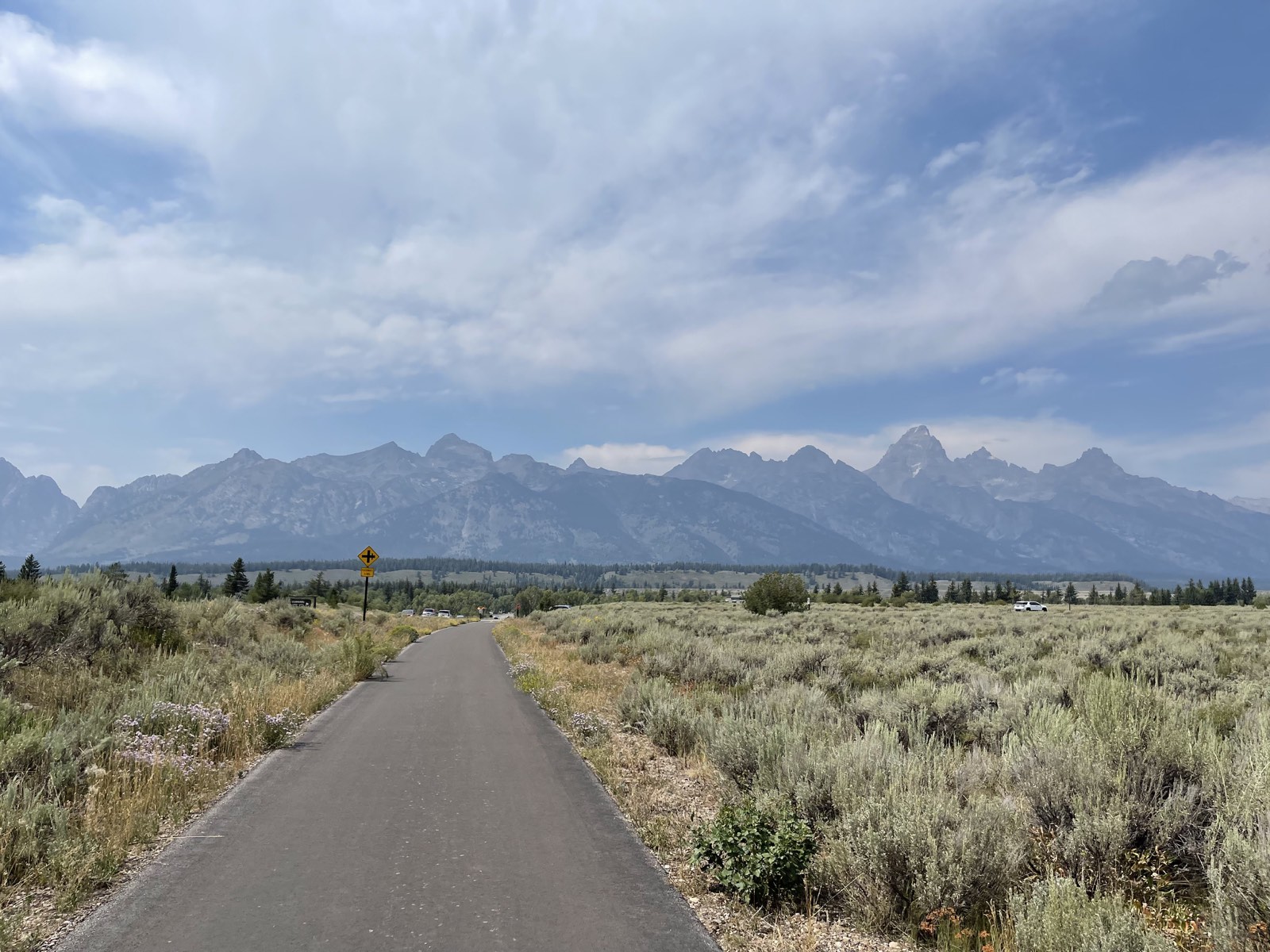 Open sagebrush flats and mountains seen from the bike path