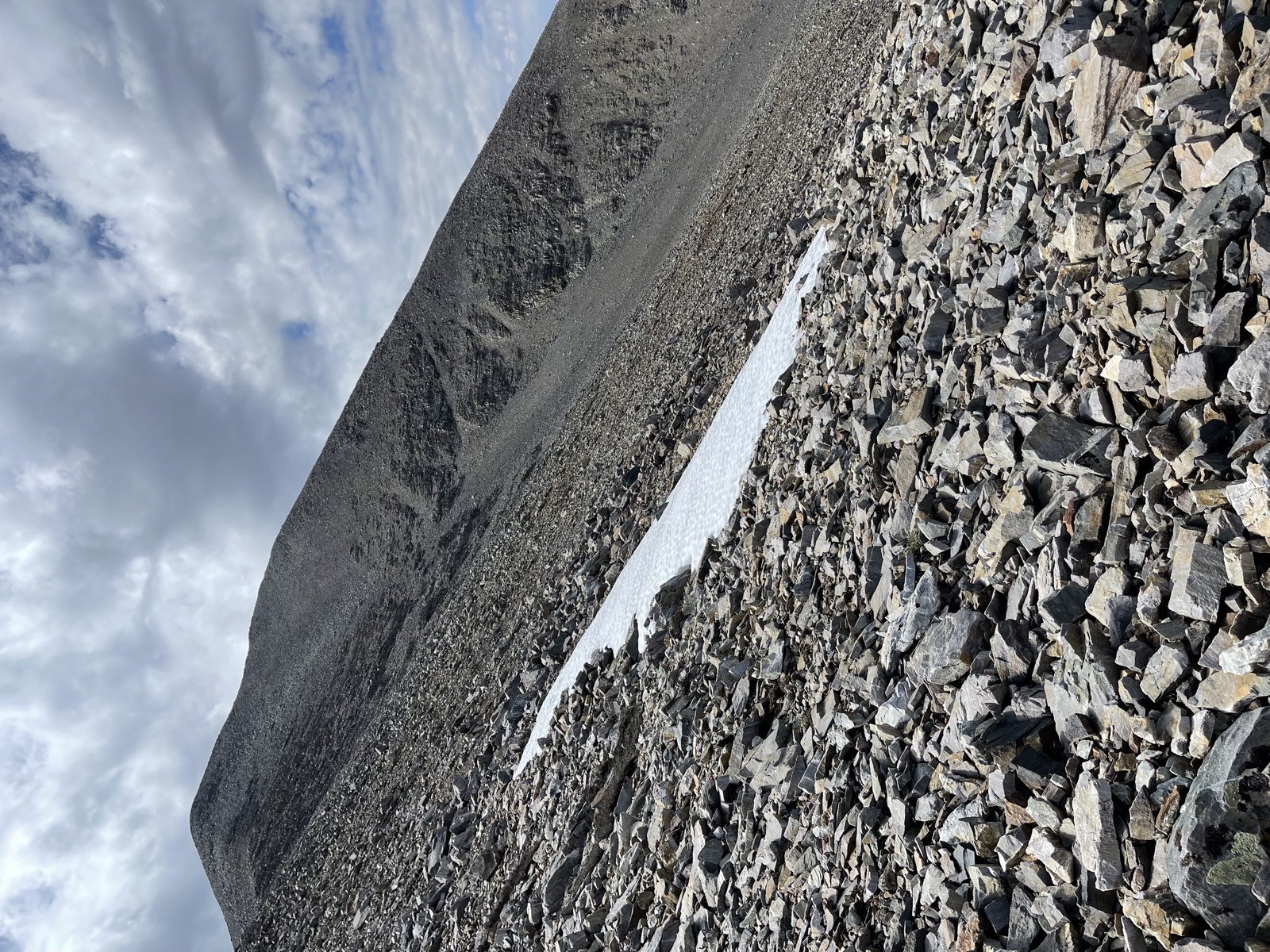 A patch of ice tucked below the ridgeline